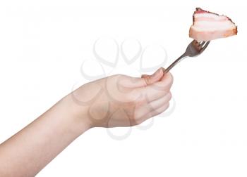 hand holds fork with impaled piece of bacon isolated on white background