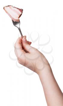 hand holding dinning fork with piece of bacon isolated on white background