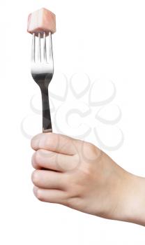 dinning fork with impaled piece of lard in hand isolated on white background
