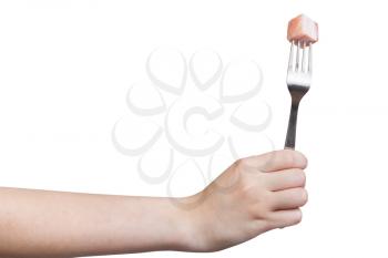 side view of fork with impaled piece of lard in hand isolated on white background