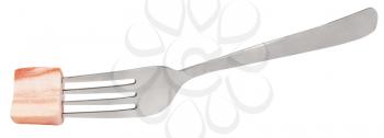 fork with impaled piece of salty lard isolated on white background