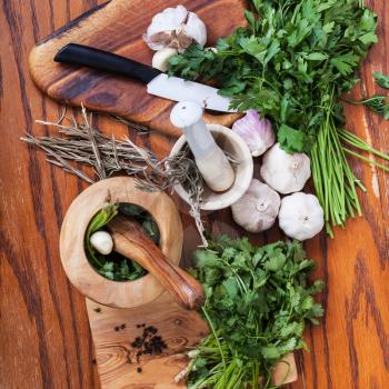 cooking seasonings - top view of mortars and spicy herbs on wooden table