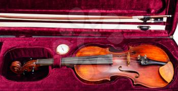 old classic violin with bow in red velvet case