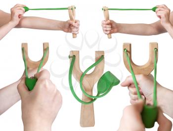 set of hands with simple wooden slingshot isolated on white background