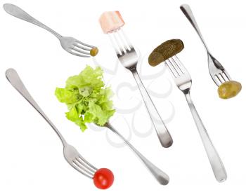 set of forks with different snacks isolated on white background