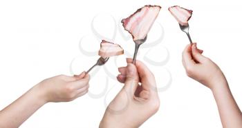 set of dinning forks with impaled piece of bacon in hands isolated on white background