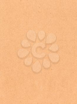 textured vertical background from natural brown packaging cardboard