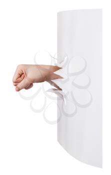 side view of the fist punches a paper wall isolated on white background