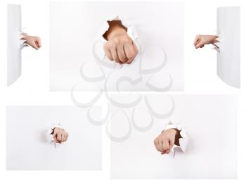set of the fists punched a paper wall isolated on white background