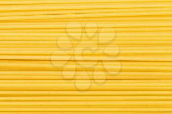 food background - many durum wheat semolina pasta spaghetti