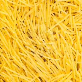 square food background - durum wheat semolina pasta filini close up