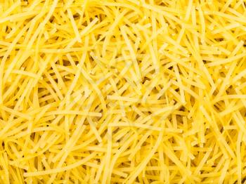 food background - many durum wheat semolina tagliolini noodles