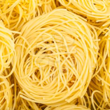 square food background - durum wheat semolina pasta fidelini
