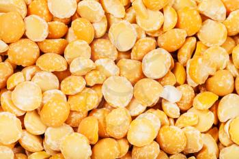 food background - raw yellow split peas close up