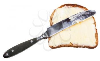 rye bread and butter sandwich with black table knife isolated on white background