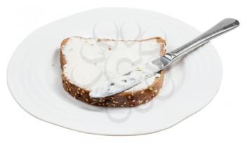 grain bread and Cheese spread sandwich with table knife on white plate isolated on white background