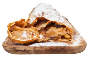 traditional viennese sliced apple strudel on wooden board isolated on white background