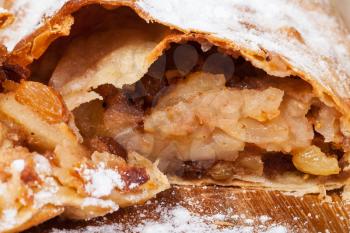 apple and raisins sweet filling in traditional viennese apple strudel close up