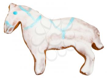 homemade Christmas festive glazed gingerbread cookie - horse figure cookie isolated on white background