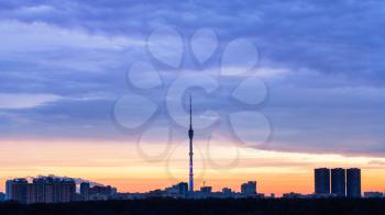 Early blue sunrise and urban panorama with TV tower in winter morning, Moscow, Russia