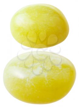 natural mineral gem stone - two Calcite gemstones isolated on white background close up