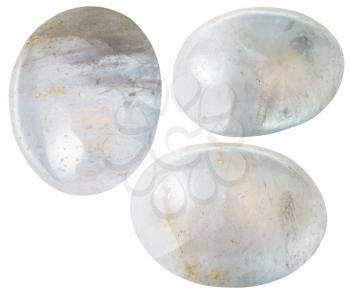natural mineral gem stone - three White Agate gemstones isolated on white background close up