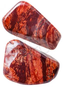 natural mineral gem stone - two red brecciated jasper gemstones isolated on white background close up