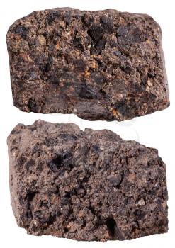 macro shooting of specimen natural rock - two pieces of peat (turf) mineral stone isolated on white background
