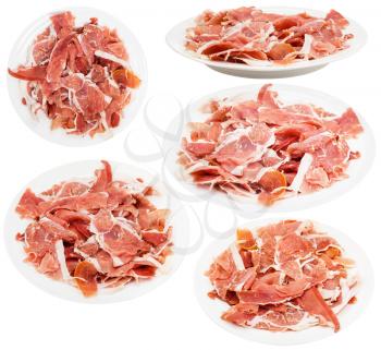 set of plates with slaced dry-cured ham isolated on white background