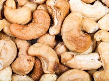 food background - many roasted cashew nuts close up