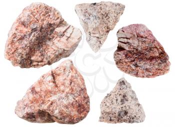macro shooting of collection natural rock - various pink granitic gneiss rock and natural mineral stones isolated on white background