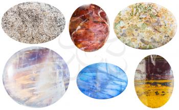 macro shooting of collection natural stones - anhydrite, sunstone, moss agate, moonstone, adularia, jaspillite cabochon gem stones isolated on white background