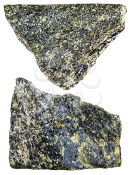 macro shooting of natural mineral stone - two pieces of Diopside crystalline rock isolated on white background
