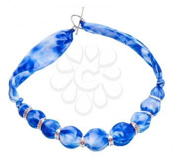 top view of textile necklace from blue painted silk balls and silver rings isolated on white background