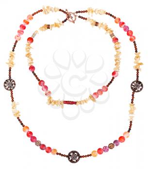 two strings of pink and yellow necklace from natural gemstones (pink Agate Dragon veins, horn, shell, mahogany obsidian beads and carved copper balls) isolated on white background