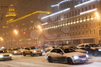 snowfall in night city - street traffic in snowfall on Garden Ring, Moscow