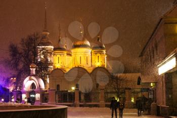 Church of the Trinity in Leaves on Bolshaya Sukharevskaya Square in Moscow during night snowfall