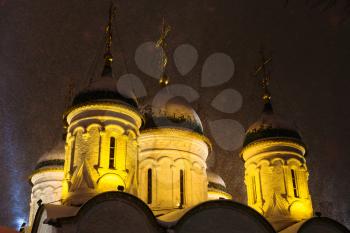 dome of Church of the Trinity in Leaves on Sretenka street under snow in Moscow in winter night