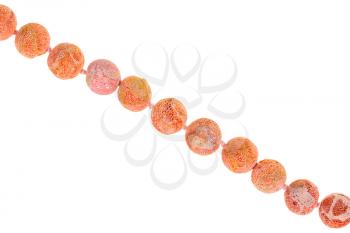 string of beads from orange sponge coral gem stone isolated on white background
