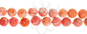 two strings of beads from orange sponge coral gem stone isolated on white background