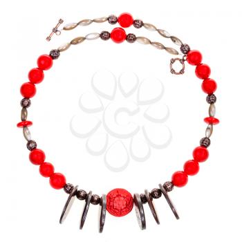 necklace from red coral, carved bone, nacre, copper beads isolated on white background