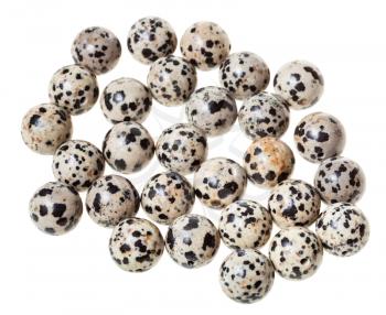 many beads from aplite (dalmatian jasper) gemstone on white background