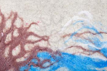 landscape with snow-covered mount, blue river, brown trees hand painted and glued on felt surface