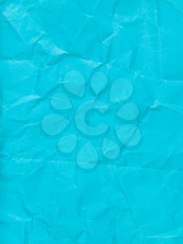 vertical background from blue colour crumpled paper