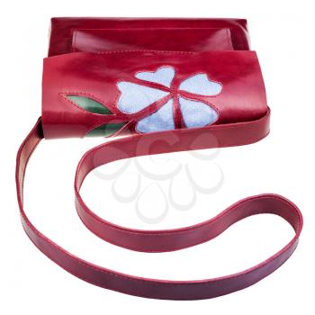 dark cherry color handbag decorated by flower applique isolated on white background