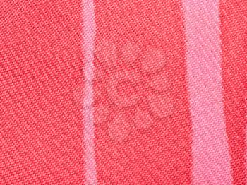 textile background - red and pink silk fabric with Serge twill weave pattern of threads close up