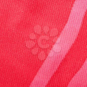 square textile background - red silk textile with Serge twill weave pattern of threads close up