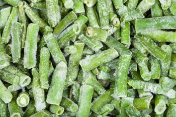food background - many frozen cut string beans close up