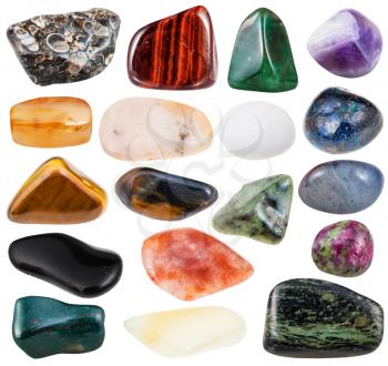 set of various polished natural mineral stones - rhyolite, anyolite, heliotrope, turritella agate, cordierite, aventurine, amethyst, opal, grossular, etc and gemstones isolated on white background