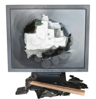 broken monitor, glass shards and hammer isolated on white background